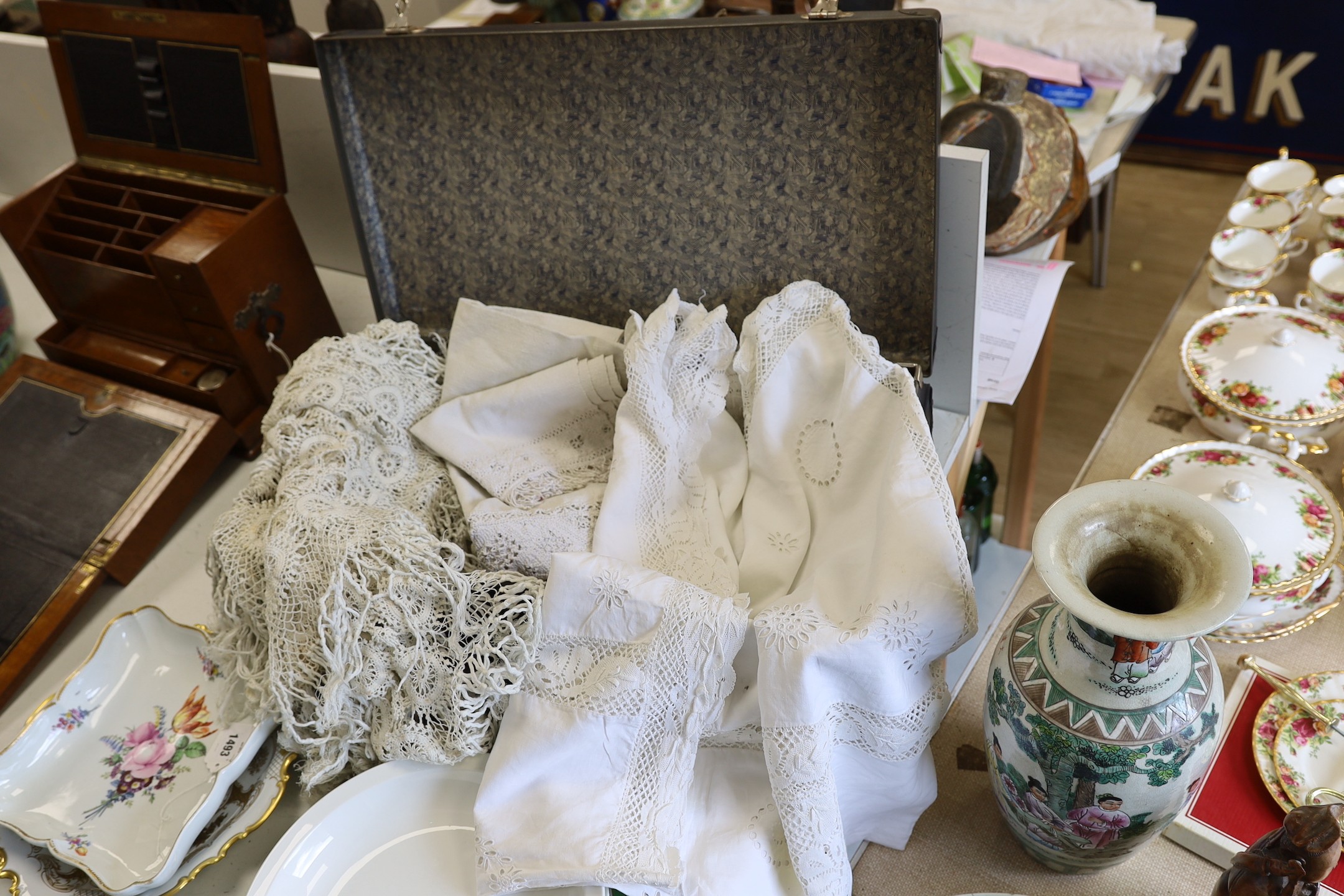 A collection late 19th early 20th century continental linen table cloths, table centres etc, some finely worked with hand made figurative, and geometric insertions and borders and an all over crochet circular finger clot